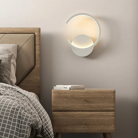 applique murale blanche en forme ronde dans la chambre